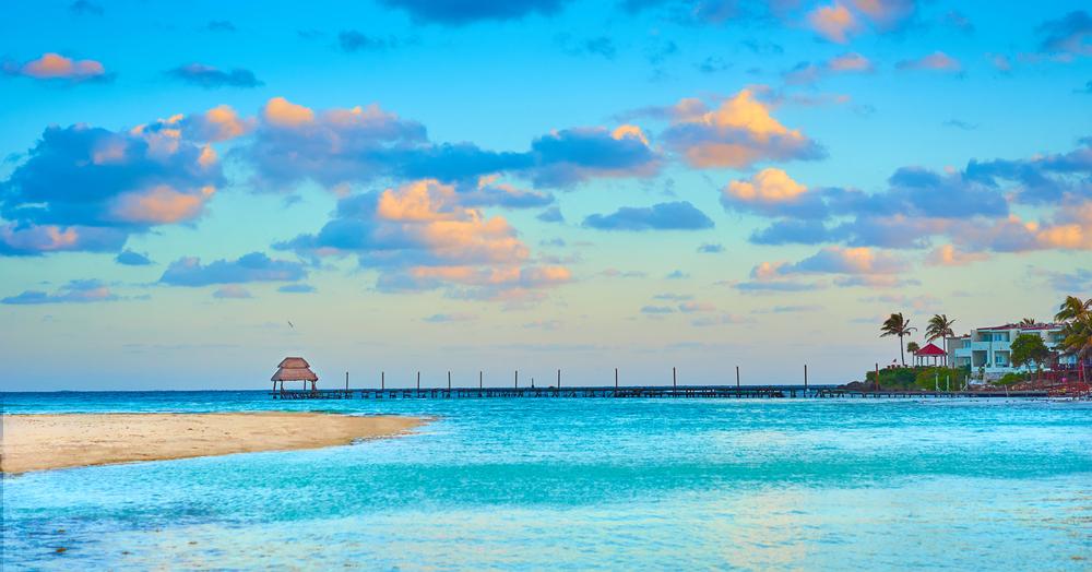 What makes Isla Mujeres a unique destination in the Mexican Caribbean?